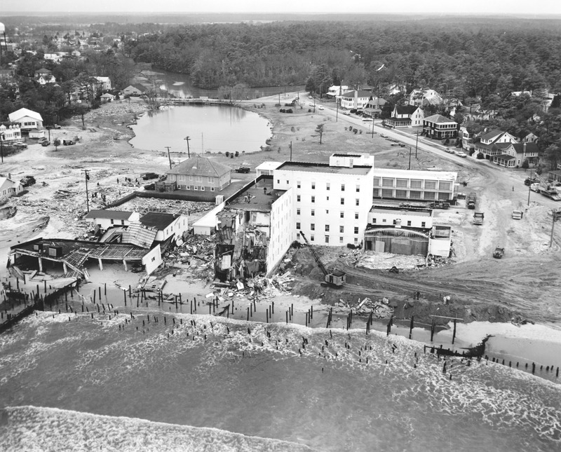 This aerial photograph shows the utter destruction on the north end of the Rehoboth Beach Boardwalk, including the damaged Henlopen Hotel. DELDOT PHOTO